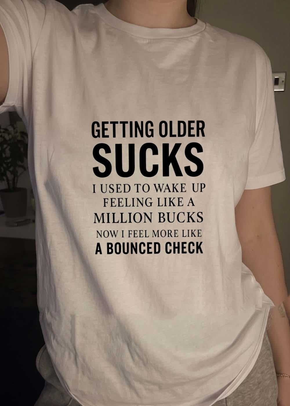 Funny Gift Getting Older Sucks Used to Wake Up Like a Million Bucks Now Bounced Check T-Shirt