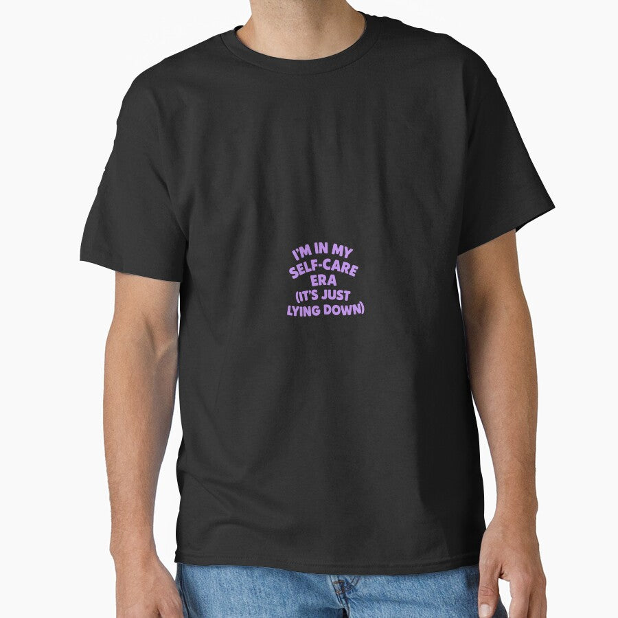 I’m in My Self-Care Era (It’s Just Lying Down) – Funny Lazy Wellness Shirt by Shut Up and Stick It