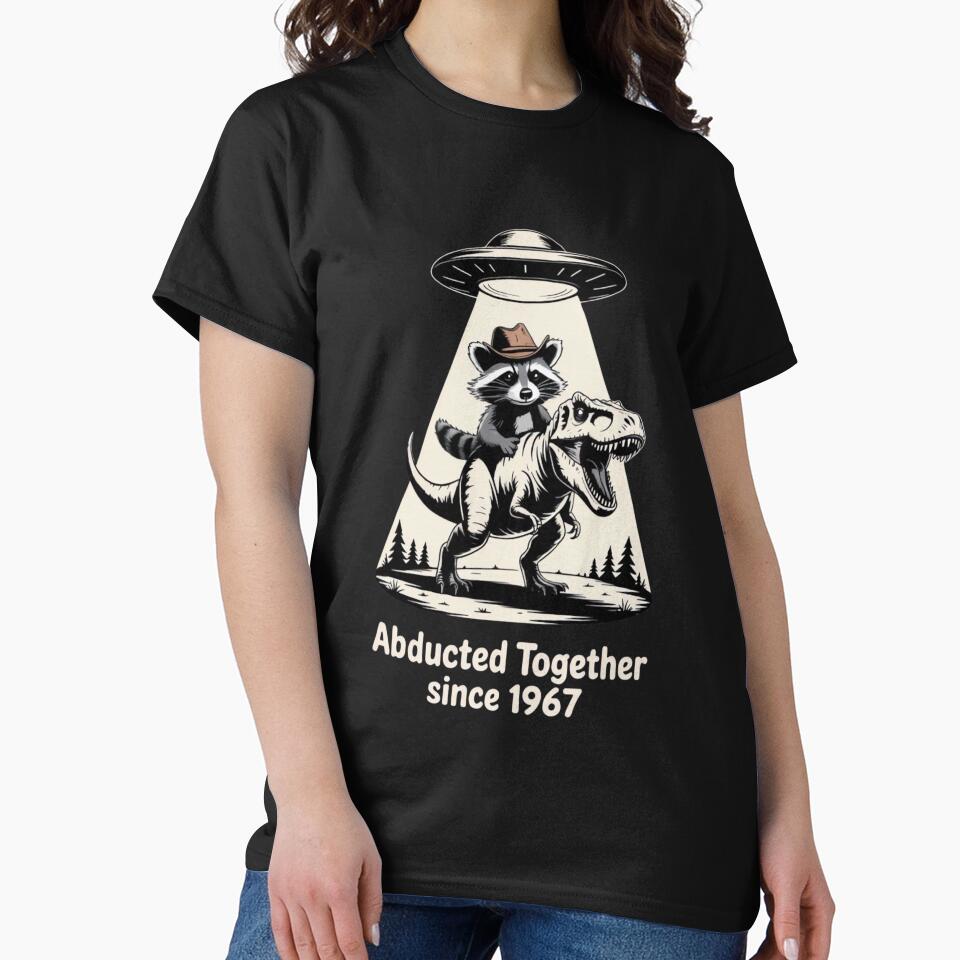Abducted Together Since 1967 – Raccoon Cowboy Riding T-Rex under UFO by ARTReMi