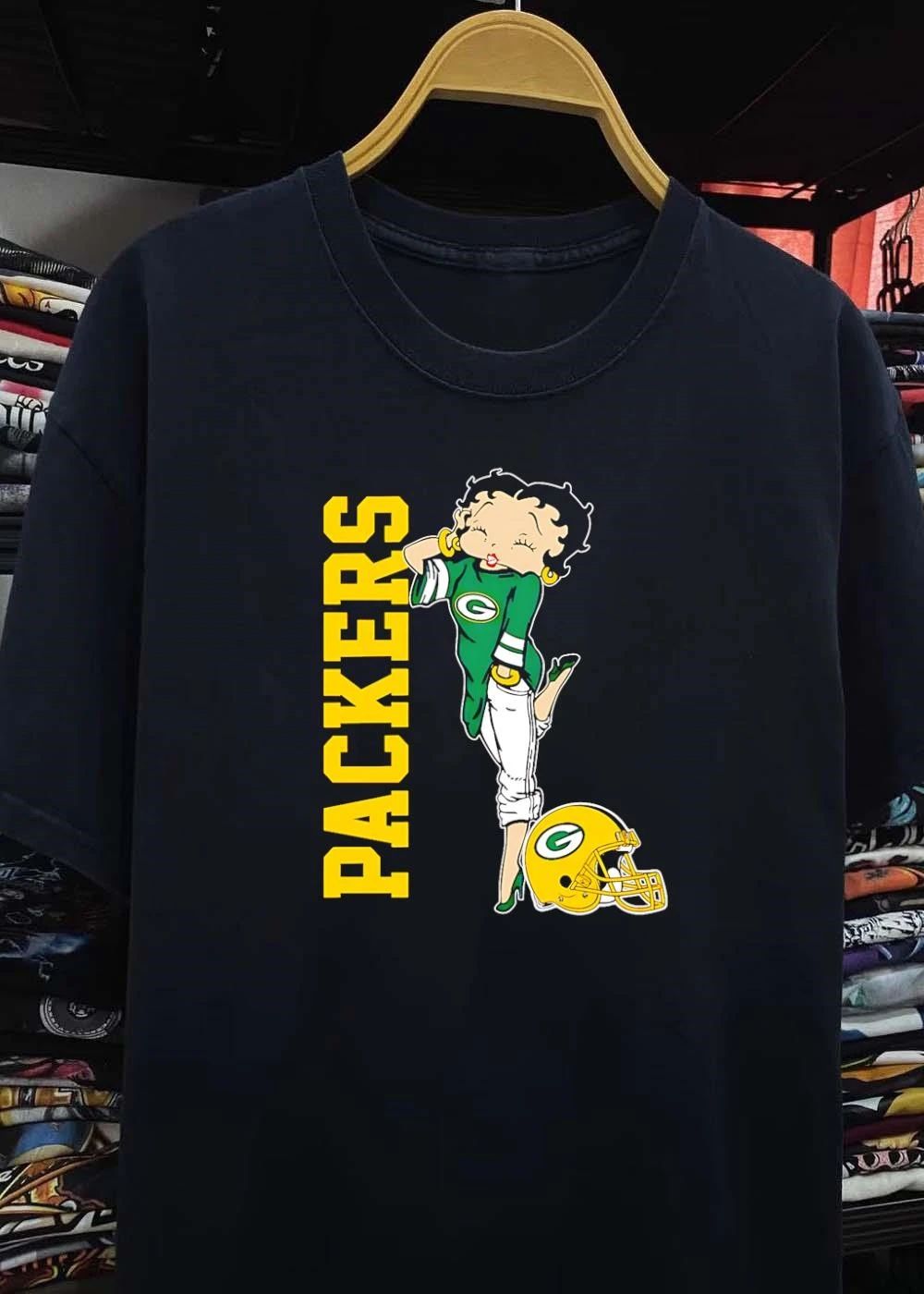 Betty Winking and Leaning on Helmet Packers shirt