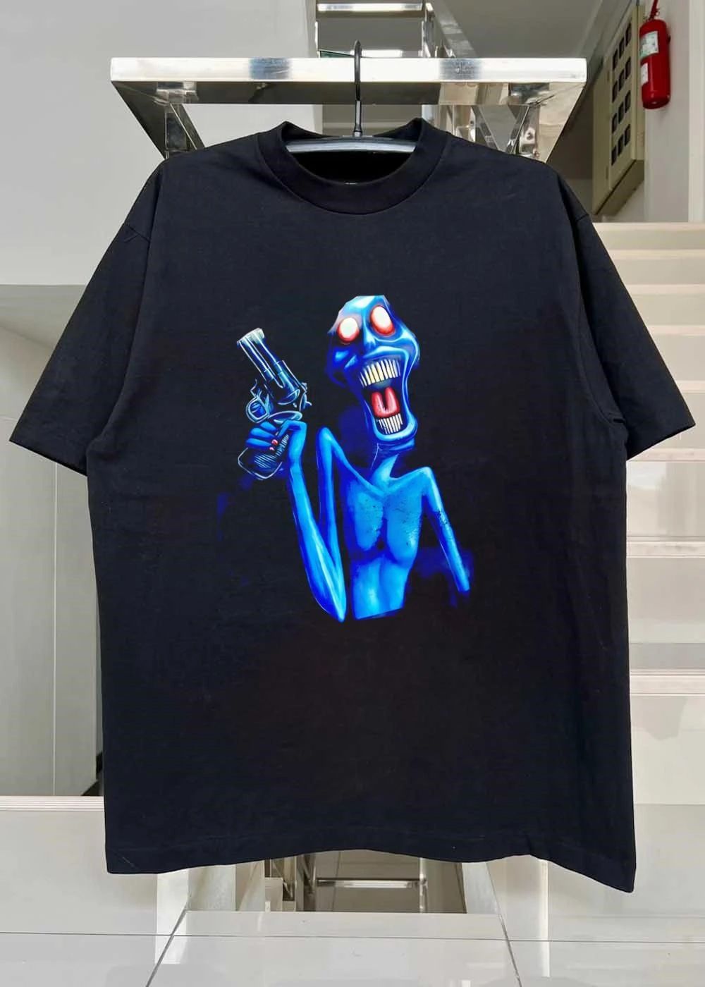 Blue Monster Holding Revolver Gun shirt